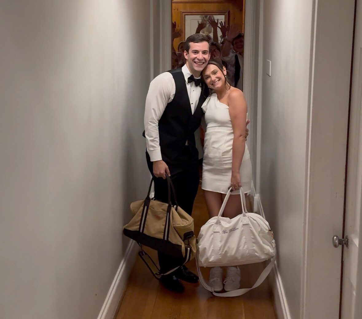 Bride and groom with their overnight bags, a candid iPhone photo