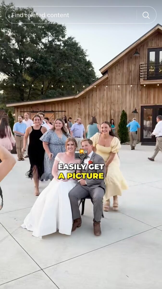 Bride and groom posing with guests outside a rustic barn venue, a wedding TikTok